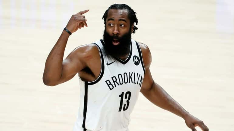 James Harden #13 of the Brooklyn Nets reacts after a...