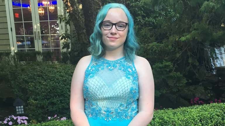 Abby Murphy shows off her teal hair at the Comsewogue...