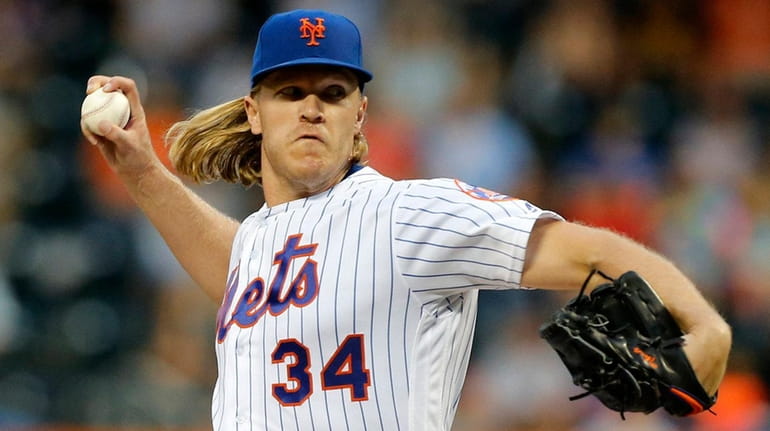 Noah Syndergaard of the Mets pitches during the second inning...
