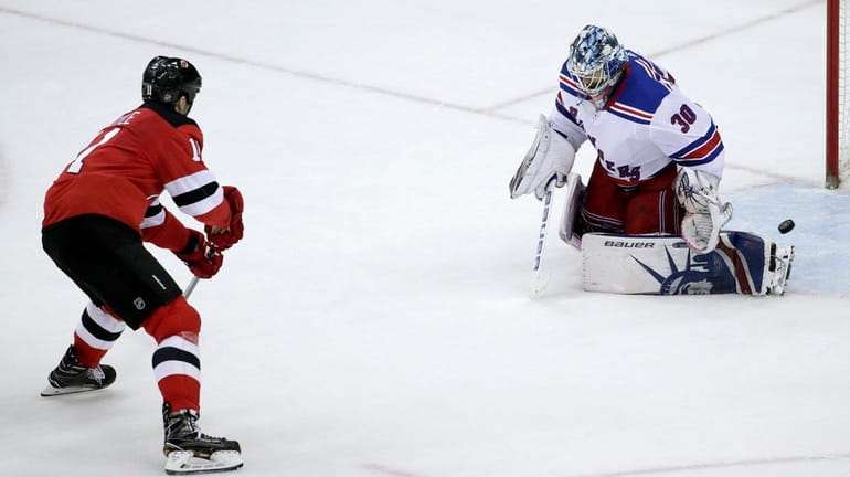 Devils center Brian Boyle scores on Rangers goalie Henrik Lundqvist...