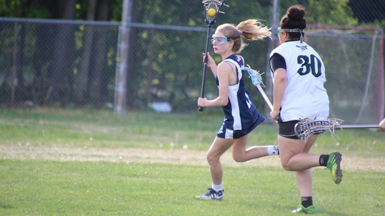 Emily Geller of Huntington plays lacrosse for the Huntington High...