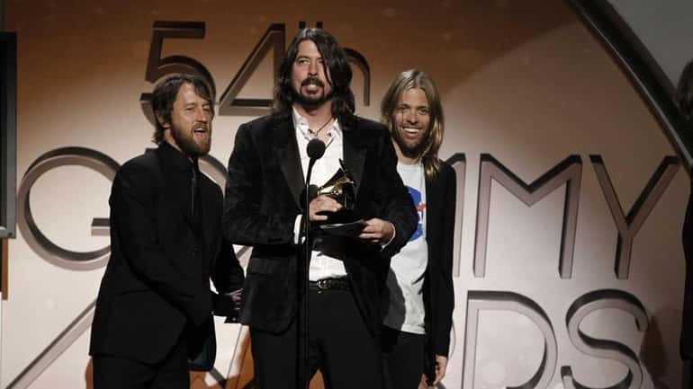 Foo Fighters accept the award for hard rock metal performance...