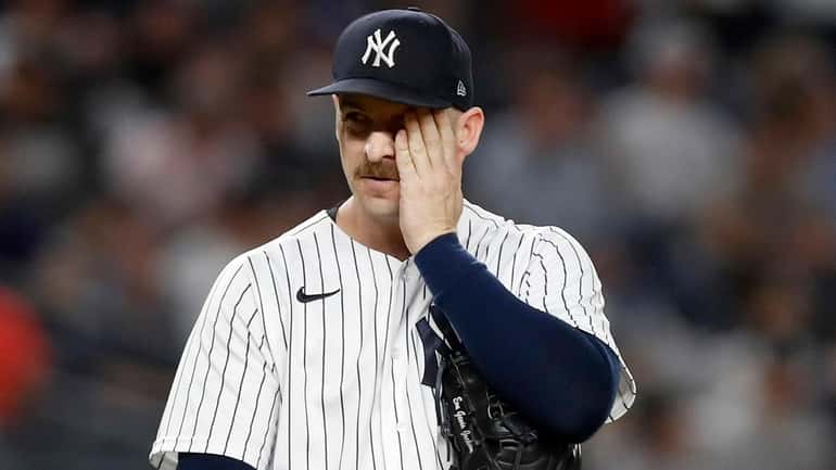 Lucas Luetge of the Yankees reacts after surrendering a run in the...
