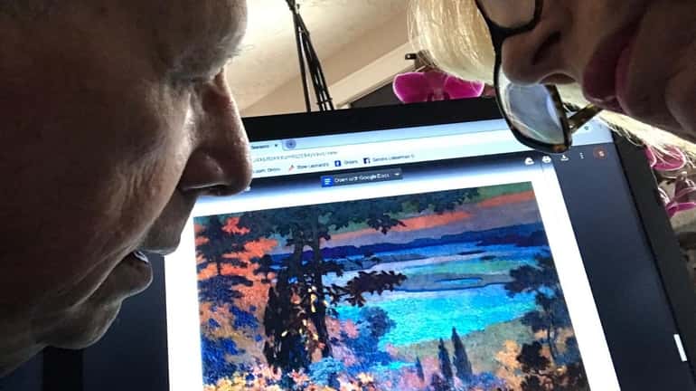 Sandra Gallof and her husband, Irwin, discuss paintings using the Long Island...
