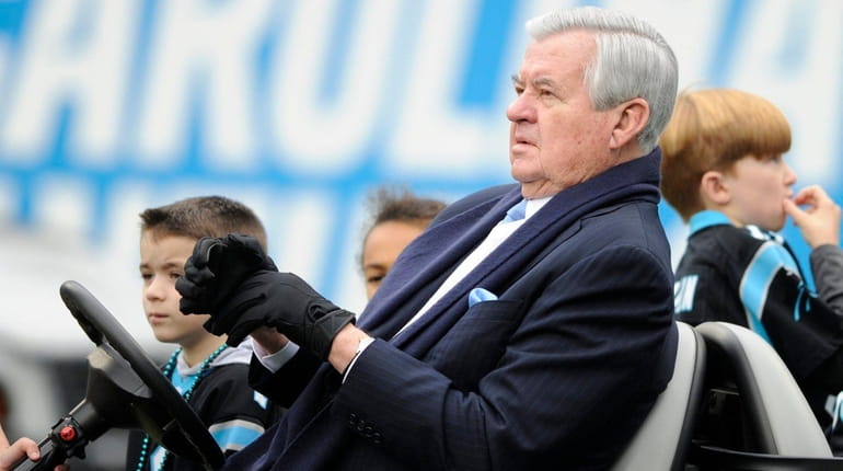 Panthers owner Jerry Richardson watches his team warm up before...