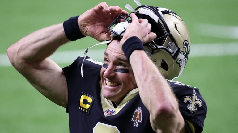 Drew Brees of the Saints celebrates after defeating the Bears in...