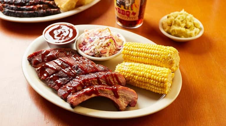 Half a rack of pork ribs with coleslaw and corn...