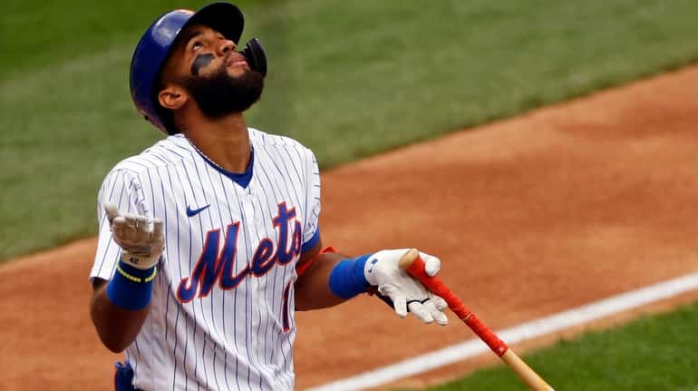 The Mets' Amed Rosario reacts after being walked during the...