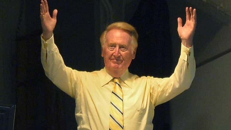 Los Angeles Dodgers broadcaster Vin Scully acknowledges fans during Vin...