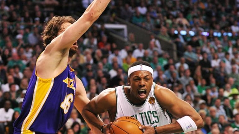 Celtics Guard-Forward Paul Pierce, right, drives past Lakers Center-Forward Pau...