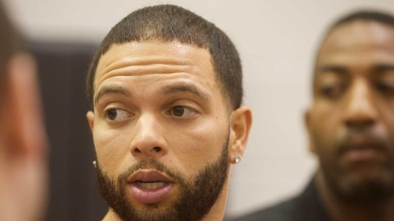 The Nets' Deron Williams appears during a news conference at...