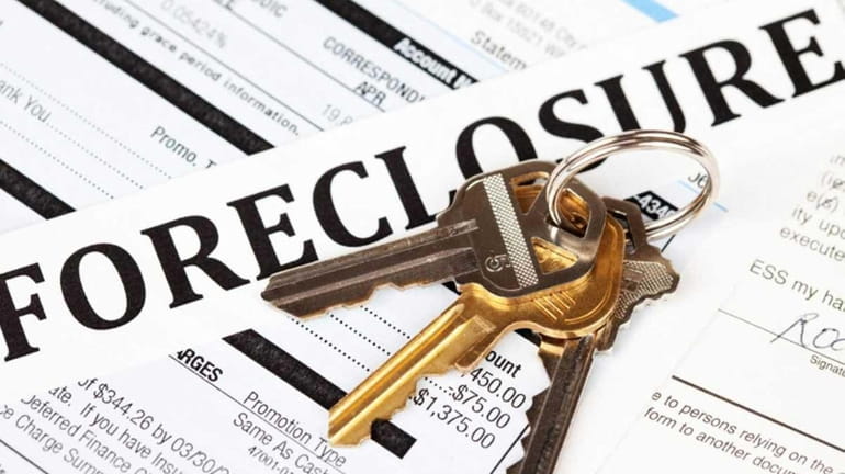 Foreclosure filings were up 50 percent in Nassau County and...