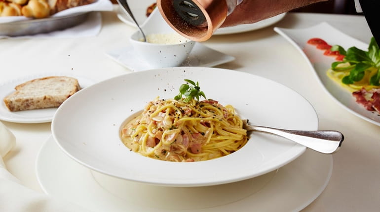 Spaghetti alla carbonara, a classic Roman dish, is prepared at Franina...