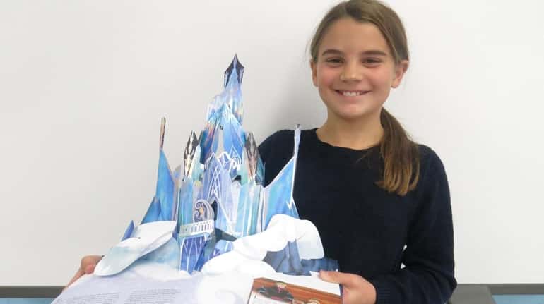 Kidsday reporter Isabella Basini with the new "Frozen"  pop-up book.