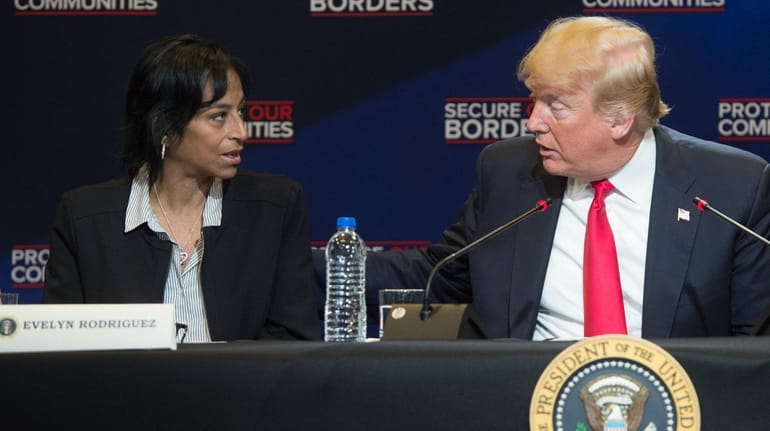 Evelyn Rodriguez with President Donald Trump during a roundtable discussion...