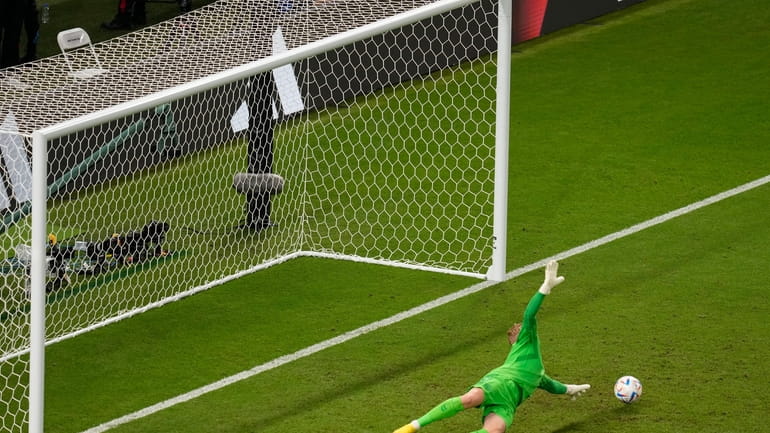 Denmark's goalkeeper Kasper Schmeichel failed to block the shot of...