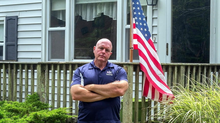 Tom Wilson outside of his home in Bellport. Wilson, a...