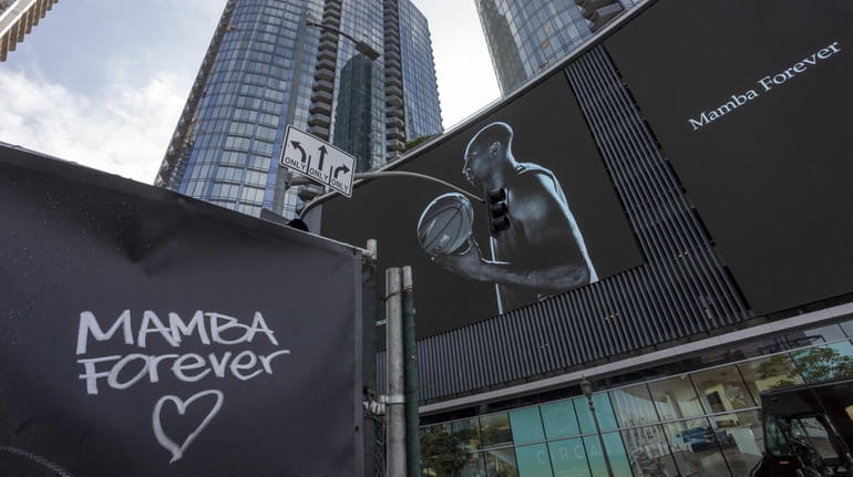 Graffiti and a mural memorialize former NBA star Kobe Bryant...