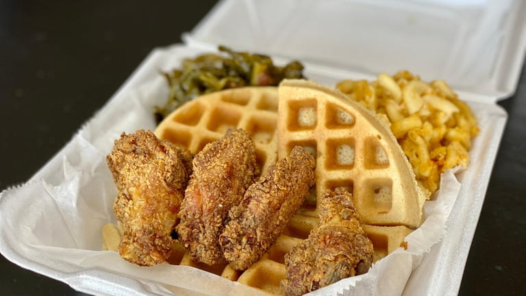 Fried chicken wings and waffles are the main event at...