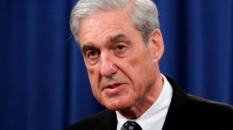 Special counsel Robert Mueller speaks at the Department of Justice...