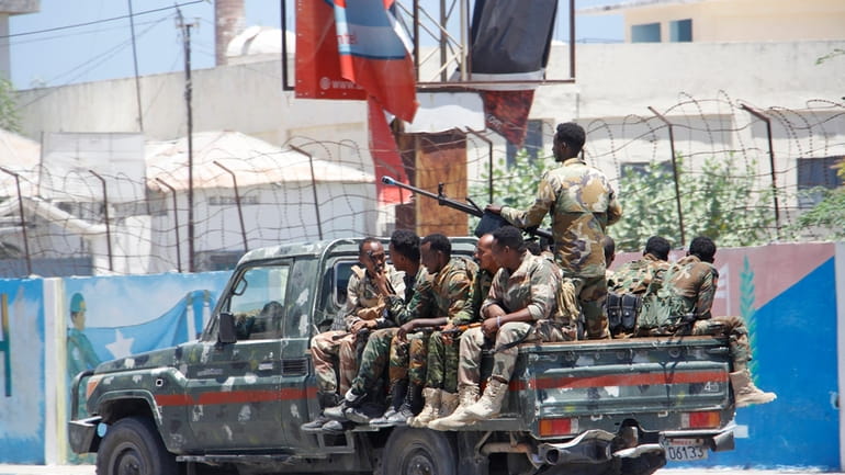 Somalia security officers patrol near the SYL hotel building which...