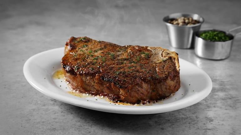 The bone-in New York strip steak at Ruth's Chris Steak House...