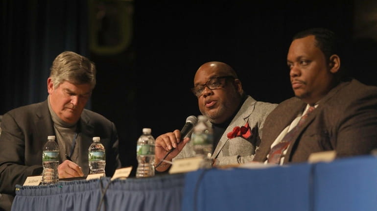 From left, state-appointed consultant Jack Bierwirth, and Hempstead School Board...