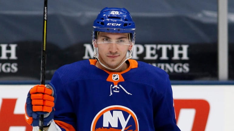Michael Dal Colle #28 of the Islanders warms up before...