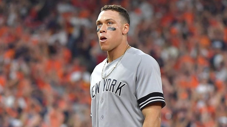 Yankees rightfielder Aaron Judge reacts after he is doubled off first base...