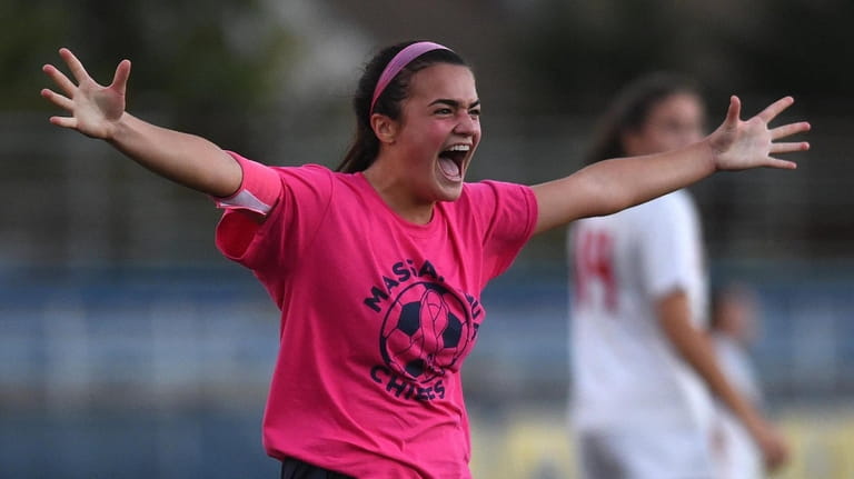 Lia Howard of Massapequa reacts after scoring vs. Syosset in...