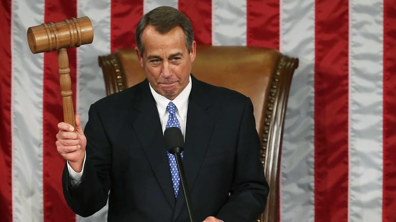 Speaker of the House John Boehner holds the gavel during...