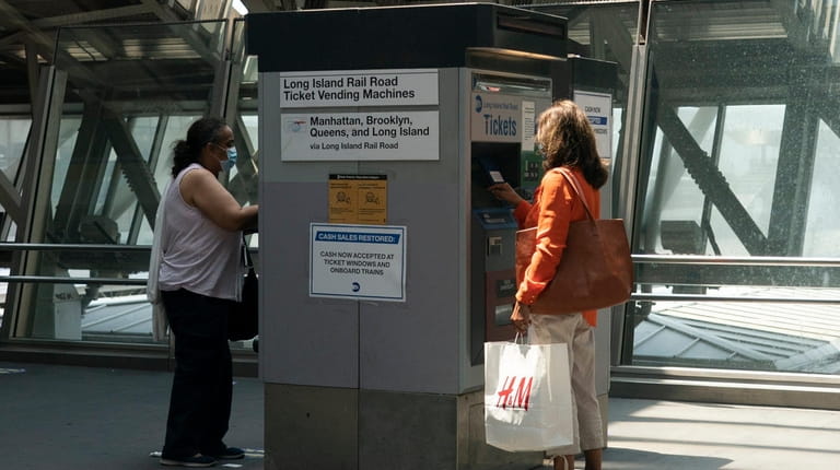 Long Island Rail Road passengers purchase tickets at Jamaica Station...