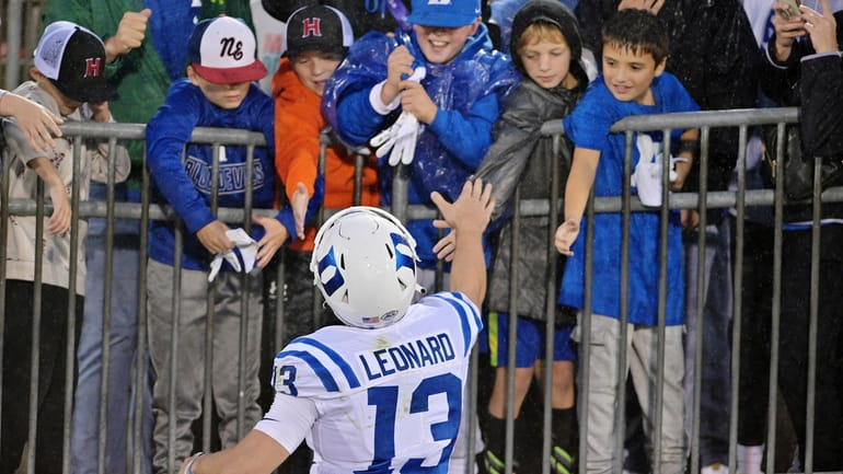 Duke quarterback Riley Leonard (13) meets fans after a victory...