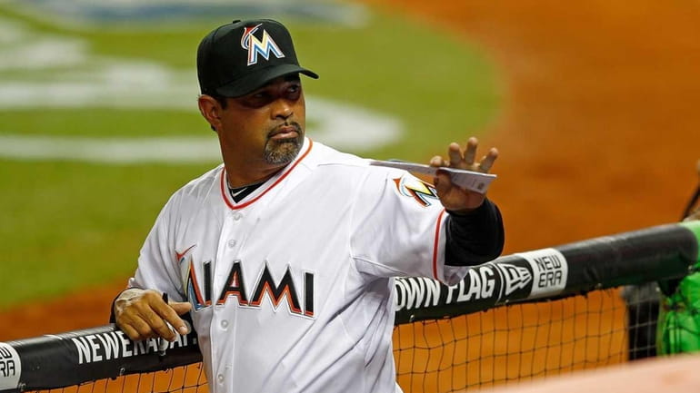 Manager Ozzie Guillen of the Miami Marlins waves during Opening...
