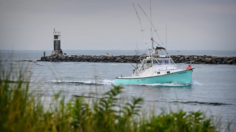 Boats head in to Lake Montauk. While homebuyers see Montauk as a...