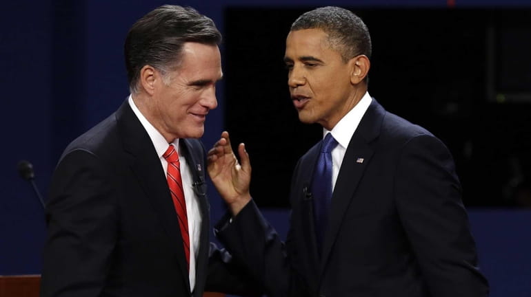 Republican presidential nominee Mitt Romney and President Barack Obama talk...
