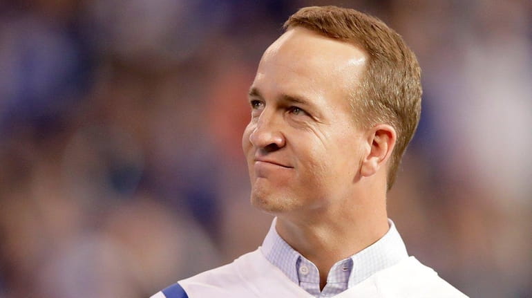Peyton Manning, former Indianapolis Colts quarterback, reacts during a ceremony...