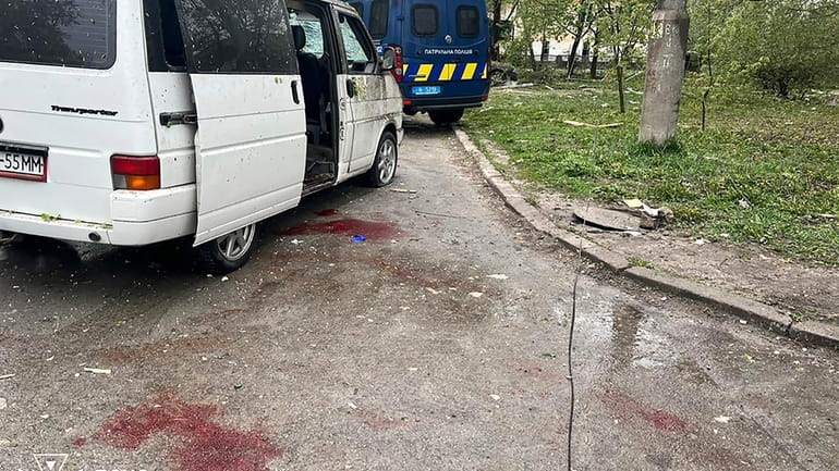 In this photo provided by the Ukrainian Emergency Service, blood...