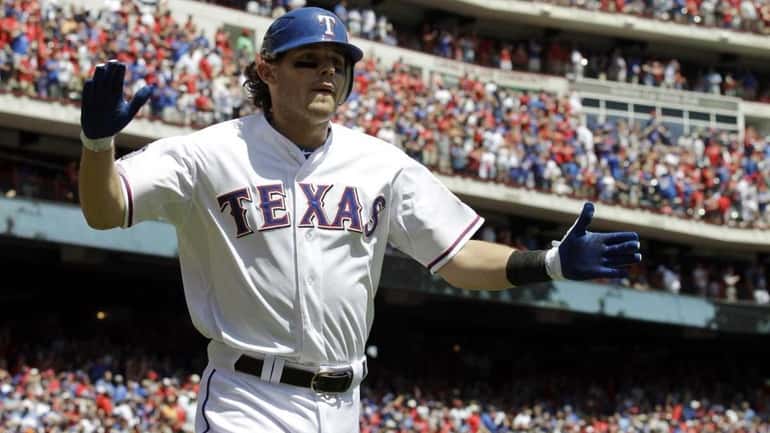 Texas Rangers' Ian Kinsler reacts after hitting a solo home...