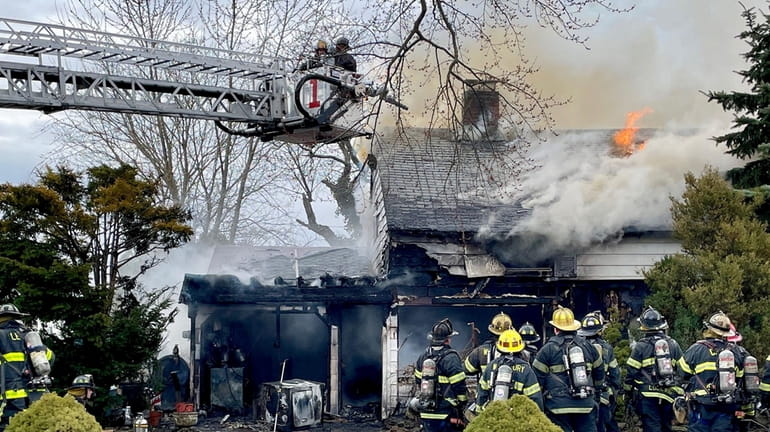 About 70 firefighters from the Hicksville, Levittown, Bethpage, Westbury and Plainview fire...