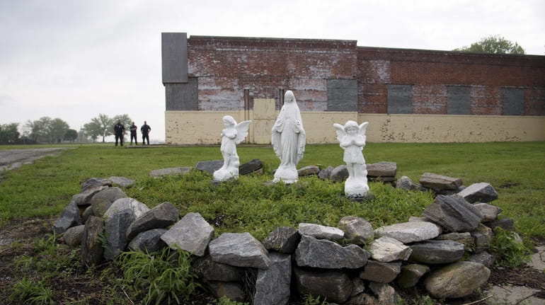 Three religious statues near the ferry dock Wednesday on Hart...