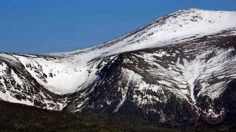 Tuckerman Ravine, seen at left in May of 2015, is about a mile...