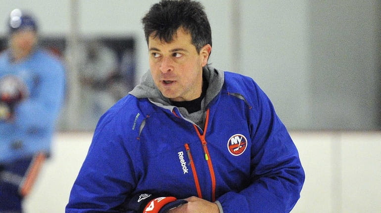 New York Islanders coach Jack Capuano skates during training camp....