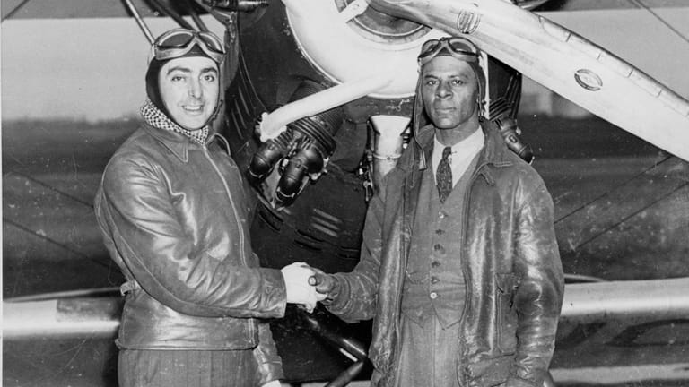 Troy Newkirk, right, who held the first African American transport...