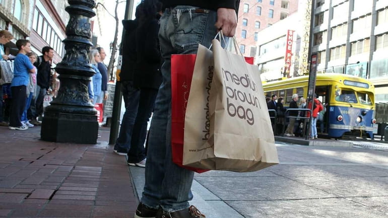 Shoppers on the hunt, like this person in San Francisco,...
