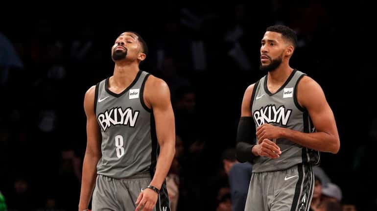 Spencer Dinwiddie #8 and Garrett Temple #17 of the Nets...