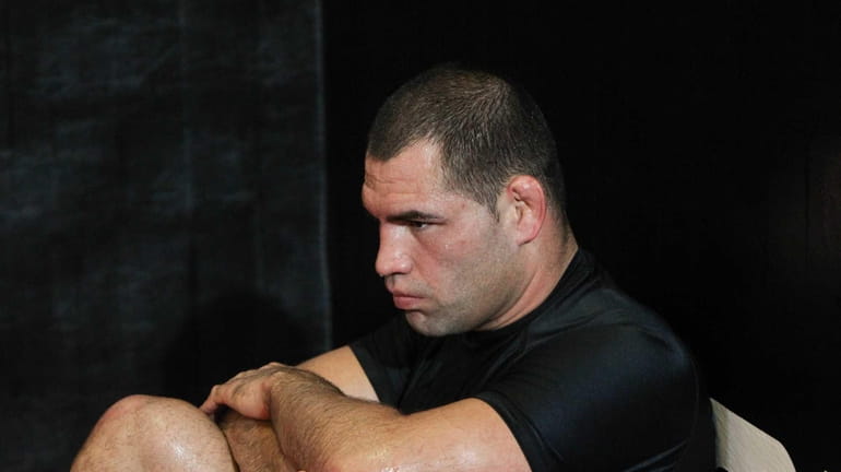 UFC fighter Cain Velasquez rests during a media day workout...