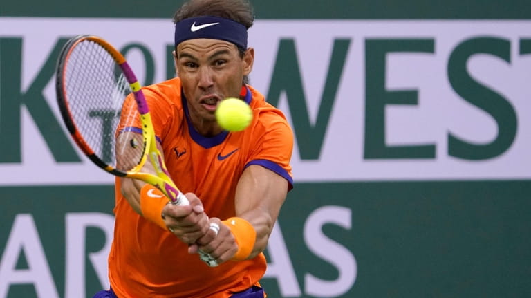 FILE - Rafael Nadal, of Spain, returns a shot to...