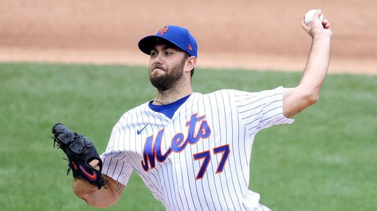 David Peterson of the Mets pitches against the Nationals in...