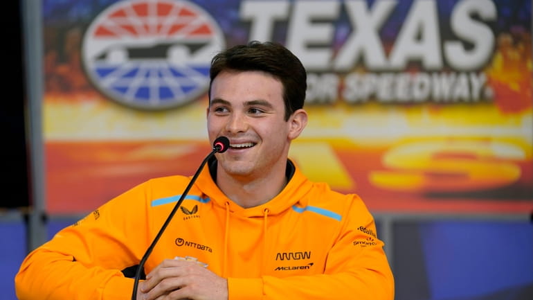 FILE - IndyCar Series driver Pato O'Ward, of Mexico, laughs...